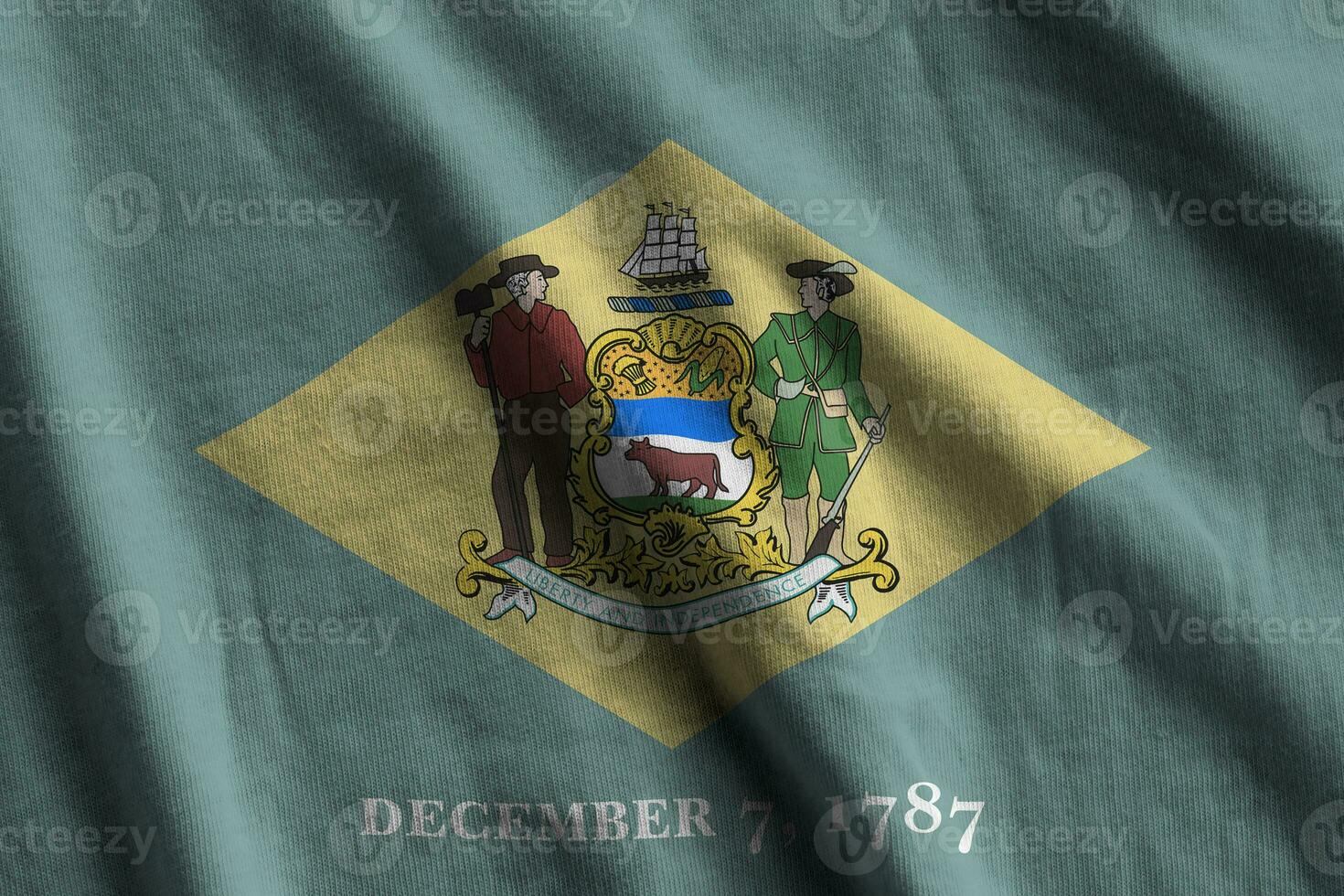 Delaware US state flag with big folds waving close up under the studio light indoors. The official symbols and colors in banner photo