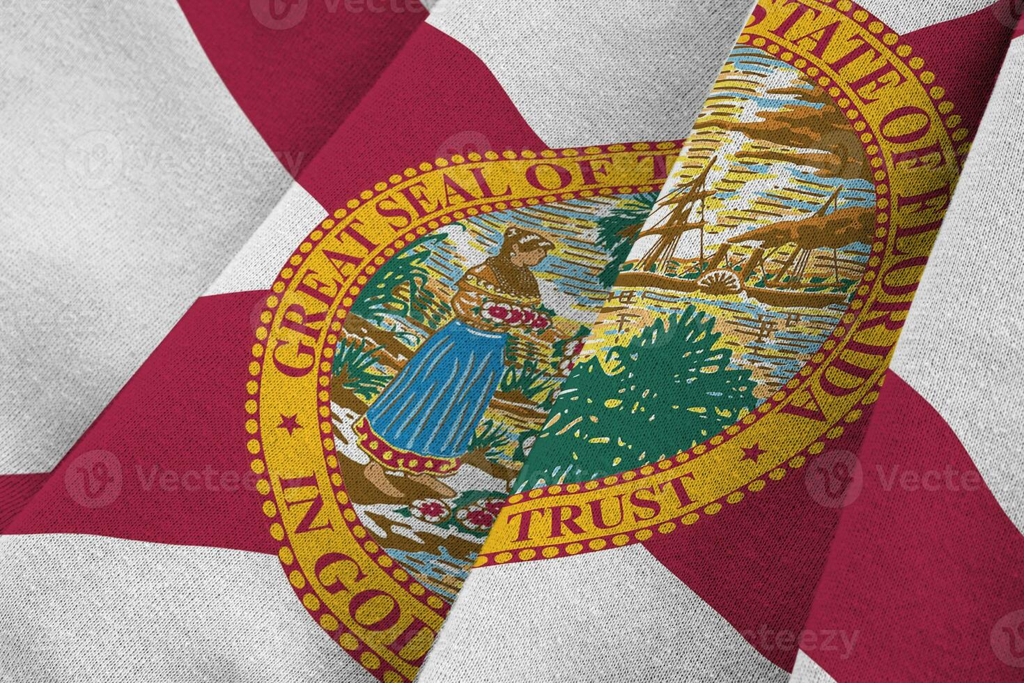 Florida US state flag with big folds waving close up under the studio light indoors. The official symbols and colors in banner photo