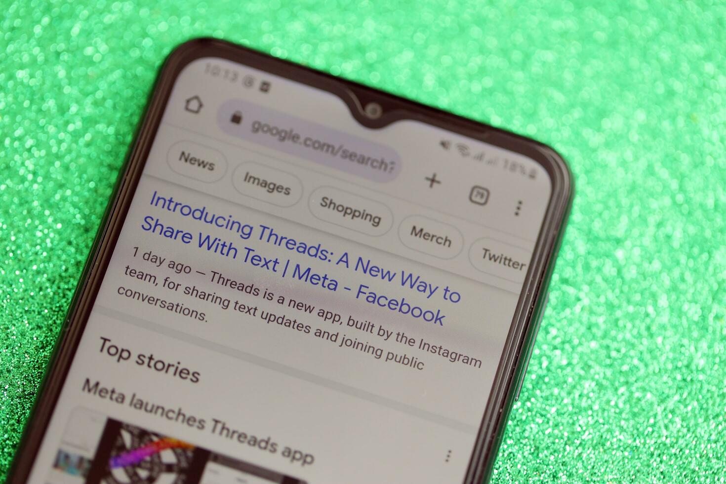 KYIV, UKRAINE - JULY 7, 2023 Threads by Meta application on display of Samsung smartphone lying on table photo