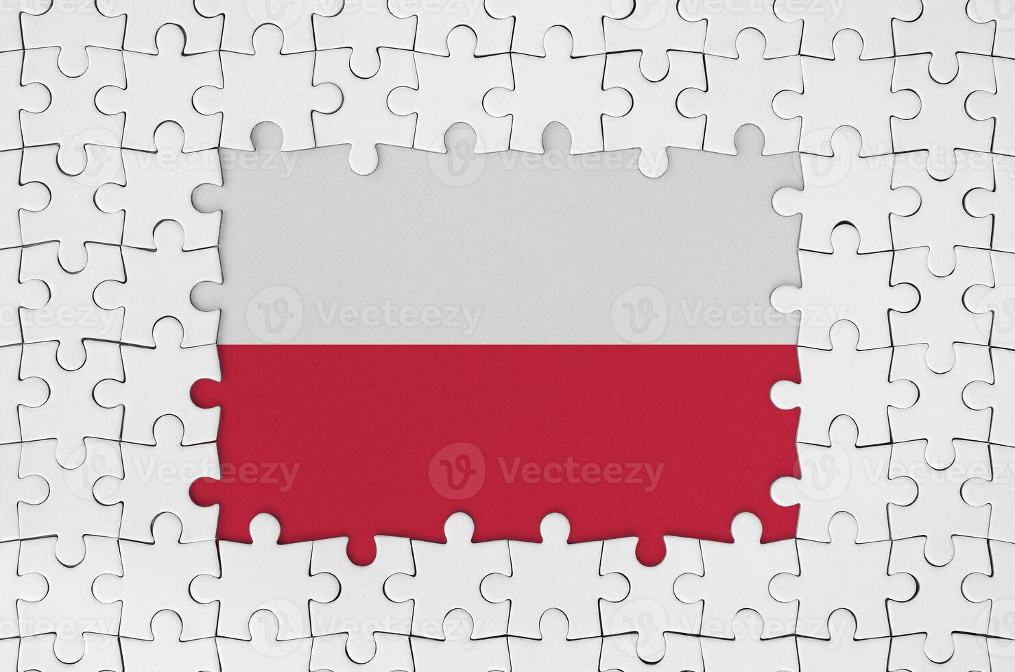Poland flag in frame of white puzzle pieces with missing central part photo