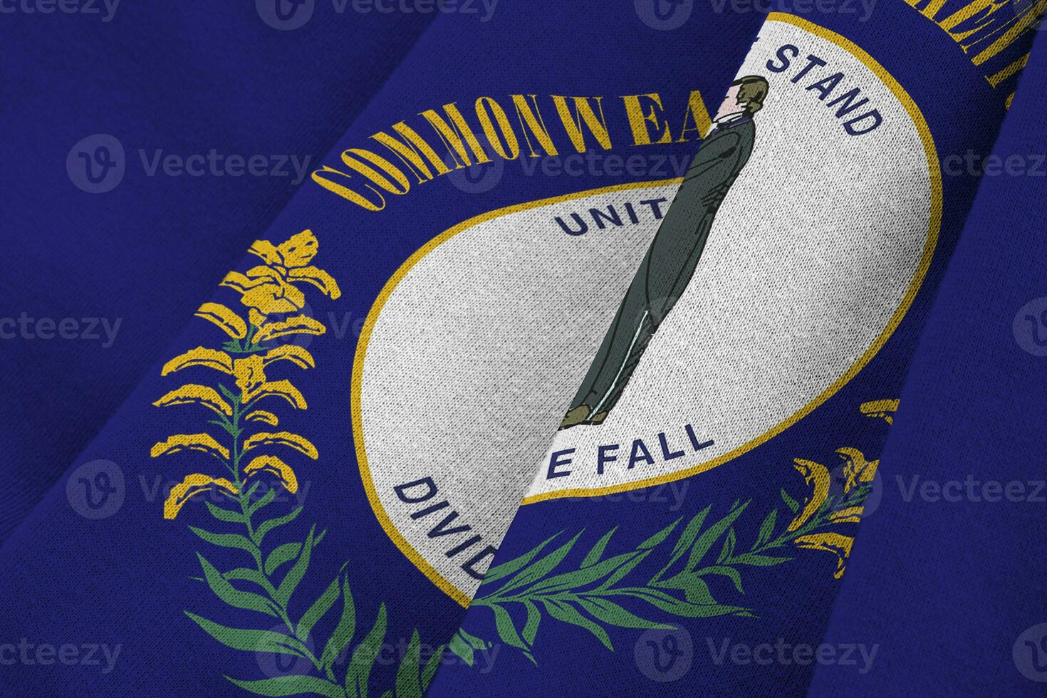 Kentucky US state flag with big folds waving close up under the studio light indoors. The official symbols and colors in banner photo