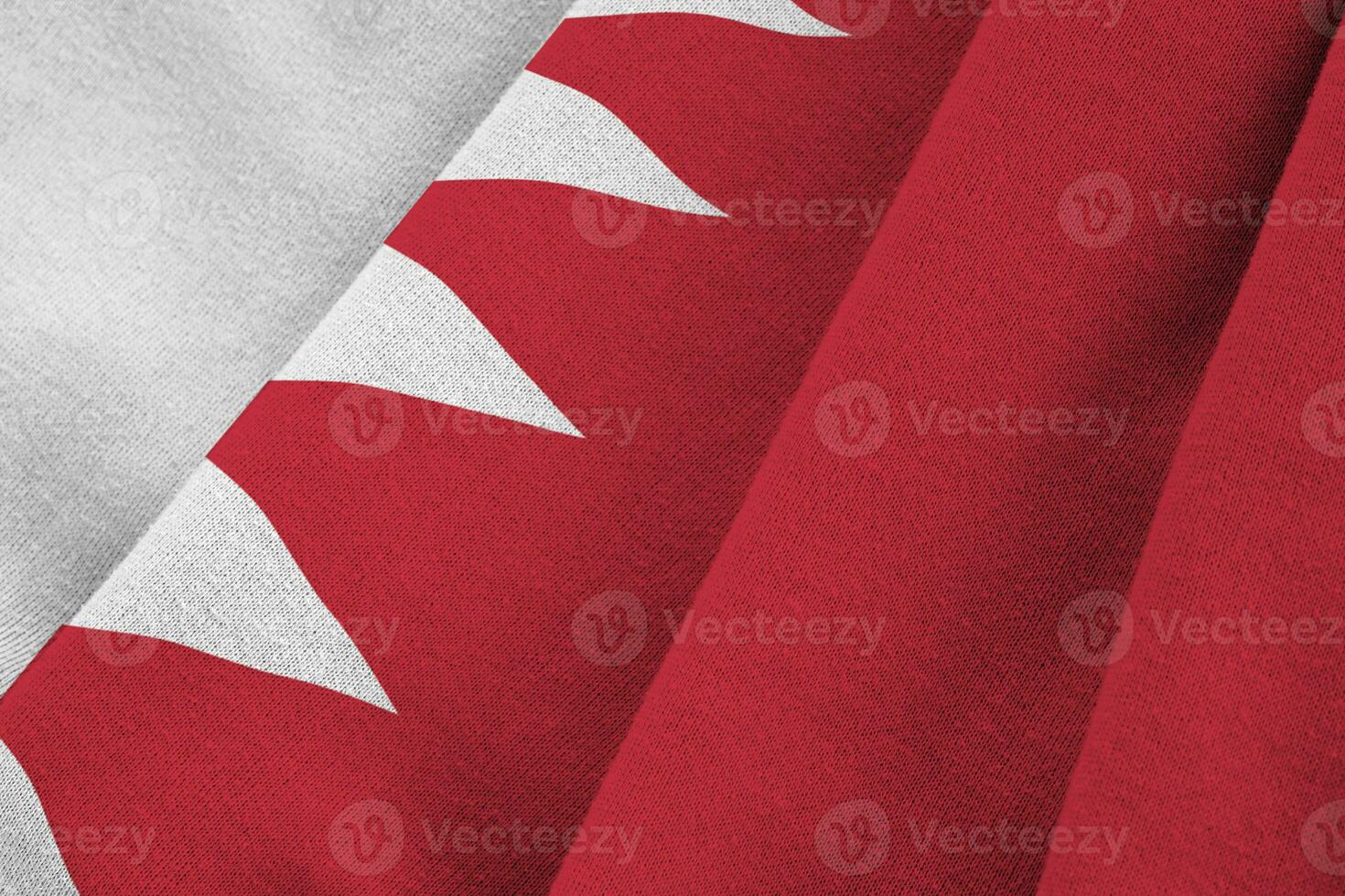 Bahrain flag with big folds waving close up under the studio light indoors. The official symbols and colors in banner photo