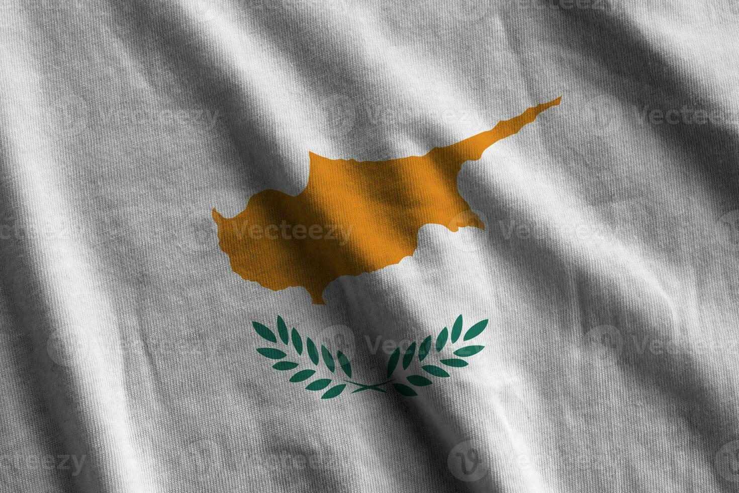 Cyprus flag with big folds waving close up under the studio light indoors. The official symbols and colors in banner photo