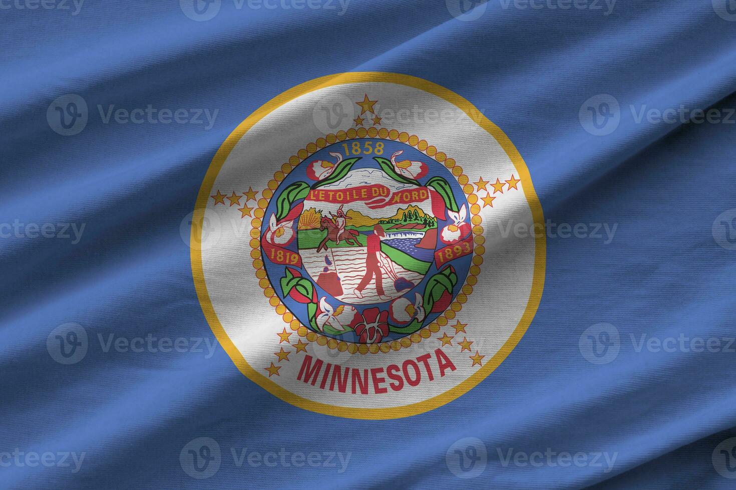 Minnesota US state flag with big folds waving close up under the studio light indoors. The official symbols and colors in banner photo