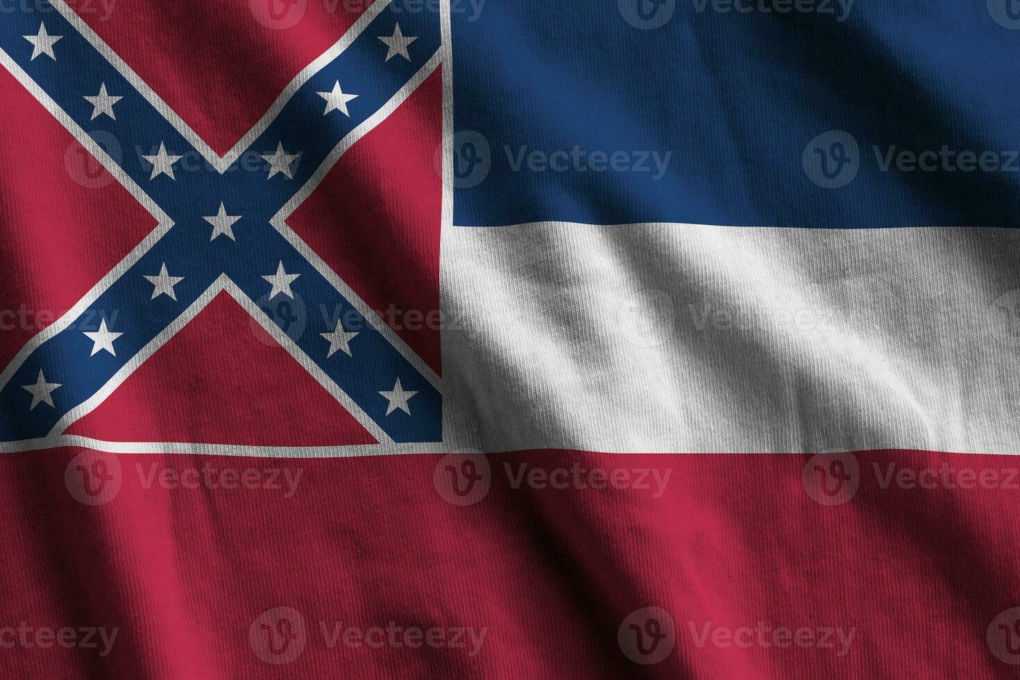 Mississippi new US state flag with big folds waving close up under the studio light indoors. The official symbols and colors in banner photo