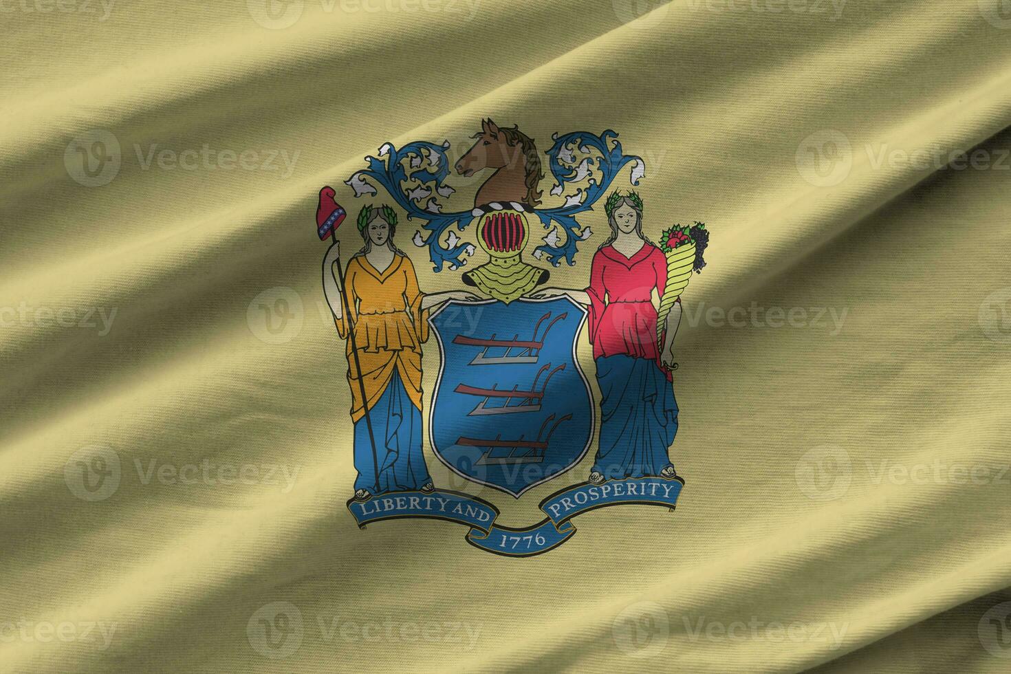 New Jersey US state flag with big folds waving close up under the studio light indoors. The official symbols and colors in banner photo