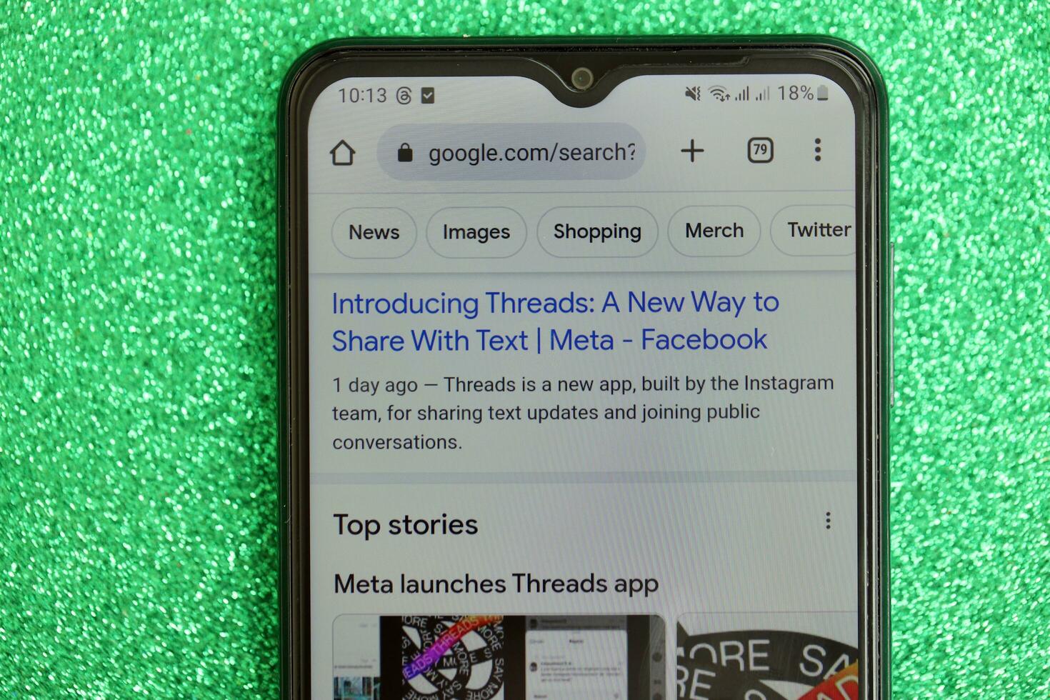 KYIV, UKRAINE - JULY 7, 2023 Threads by Meta application on display of Samsung smartphone lying on table photo