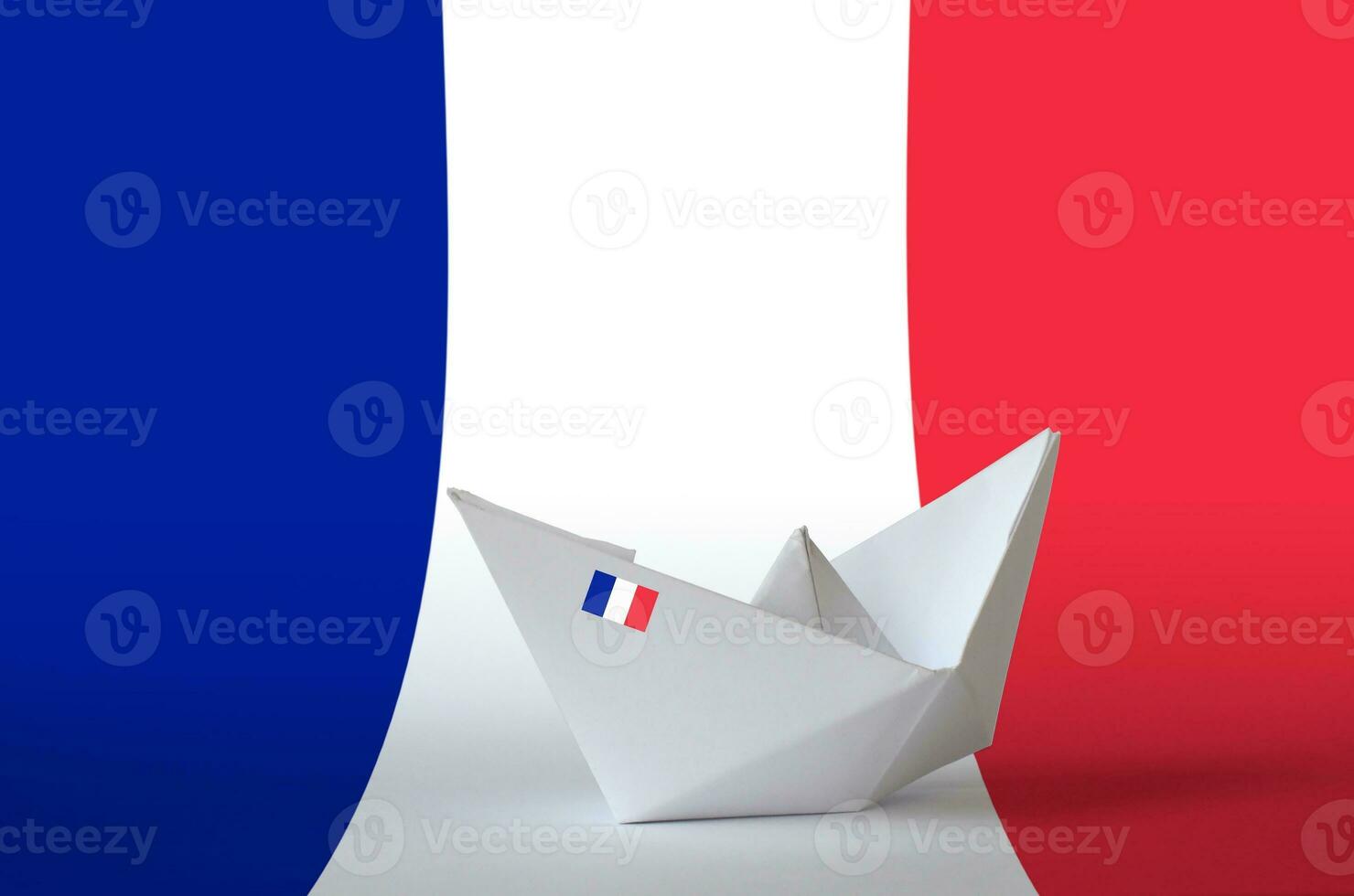 France flag depicted on paper origami ship closeup. Handmade arts concept photo