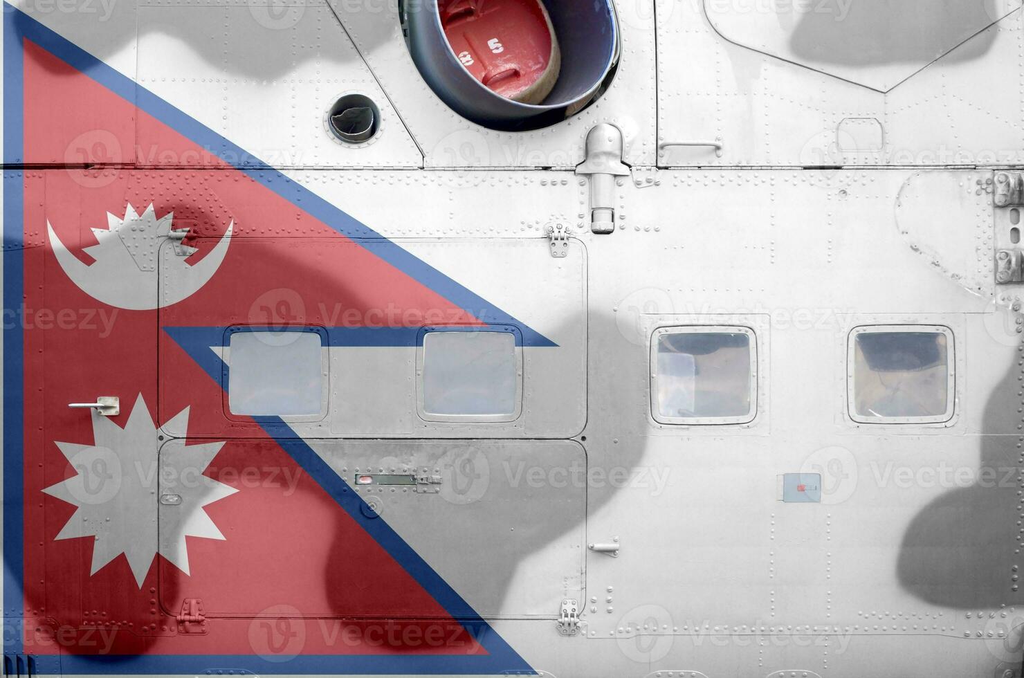 Nepal flag depicted on side part of military armored helicopter closeup. Army forces aircraft conceptual background photo