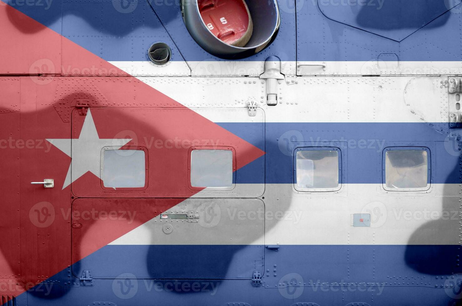 Cuba flag depicted on side part of military armored helicopter closeup. Army forces aircraft conceptual background photo