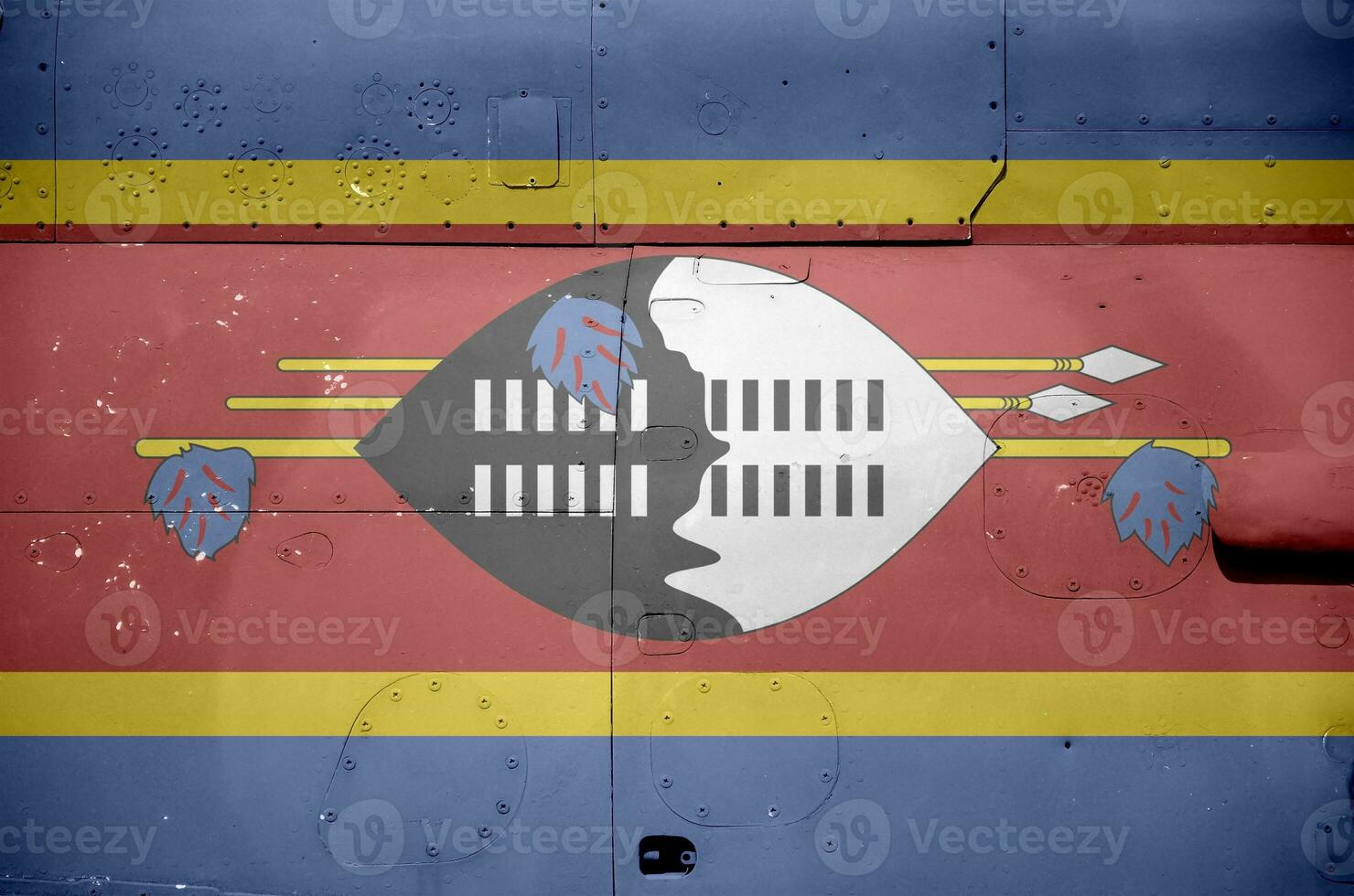 Swaziland flag depicted on side part of military armored helicopter closeup. Army forces aircraft conceptual background photo