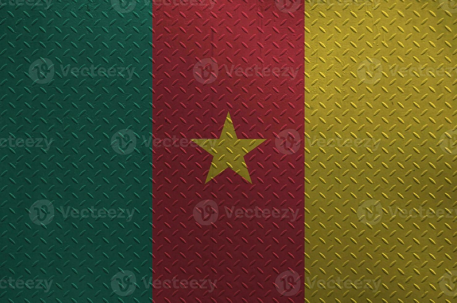 Cameroon flag depicted in paint colors on old brushed metal plate or wall closeup. Textured banner on rough background photo