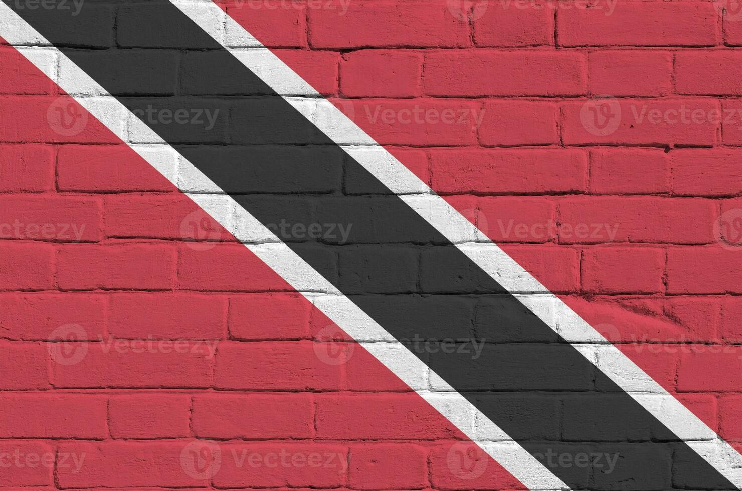 Trinidad and Tobago flag depicted in paint colors on old brick wall. Textured banner on big brick wall masonry background photo