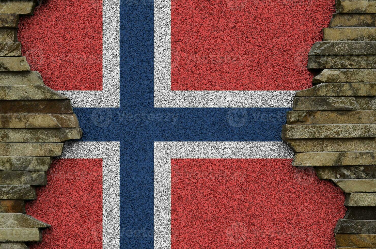Norway flag depicted in paint colors on old stone wall closeup. Textured banner on rock wall background photo