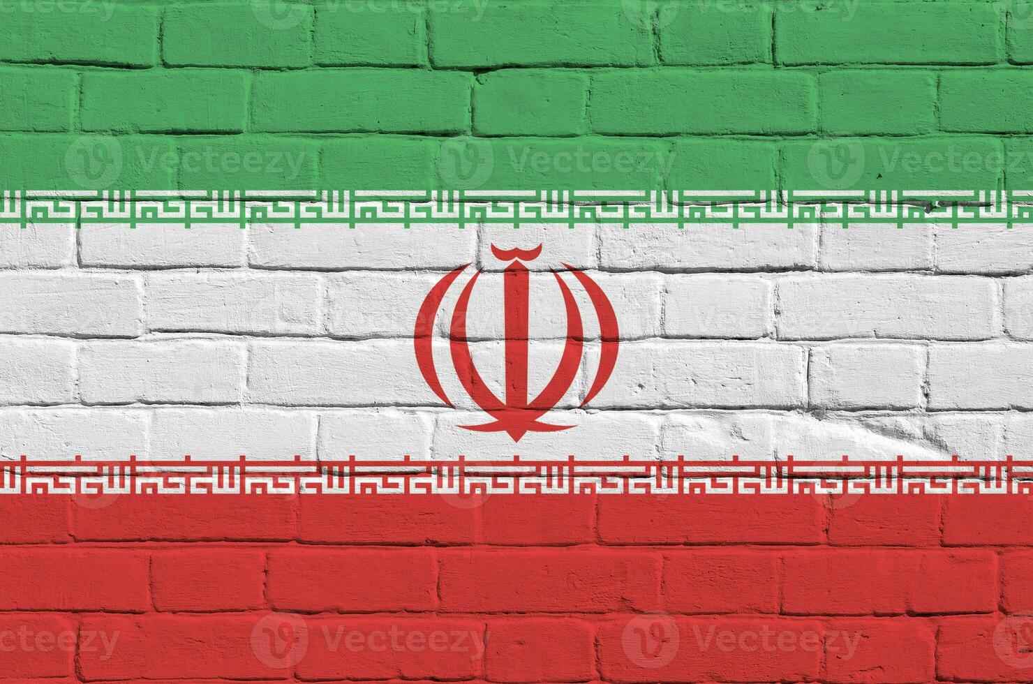 Iran flag depicted in paint colors on old brick wall. Textured banner on big brick wall masonry background photo