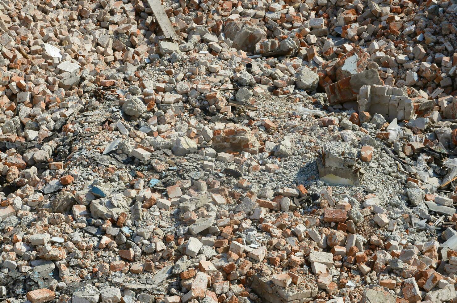 Pile of bricks and fragments of concrete from destroyed building photo