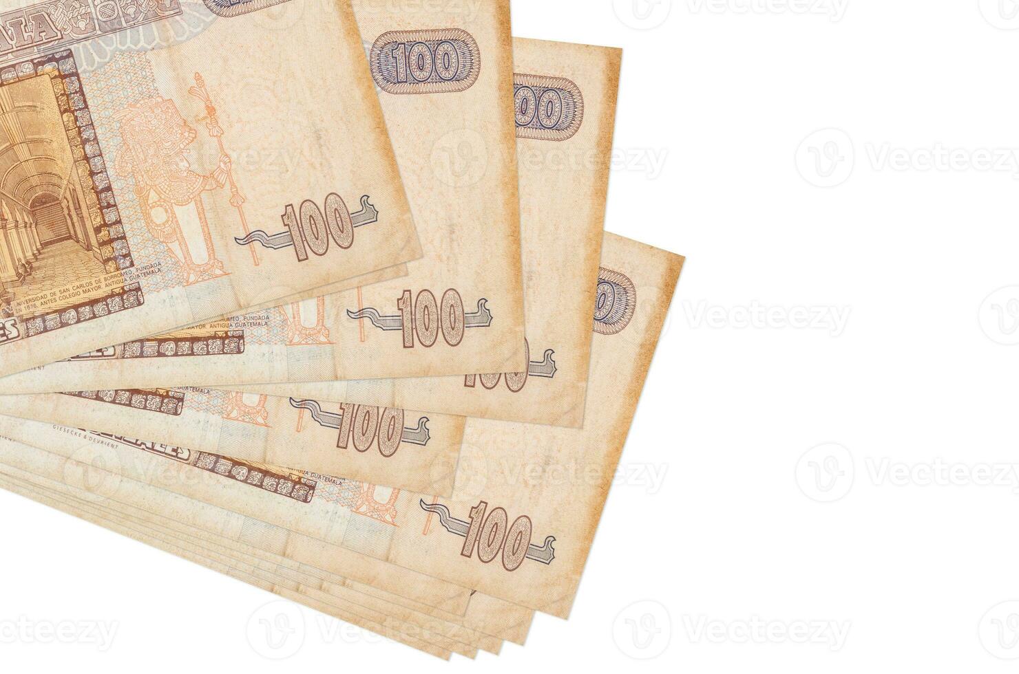 100 Guatemalan quetzales bills lies in small bunch or pack isolated on white. Mockup with copy space. Business and currency exchange photo