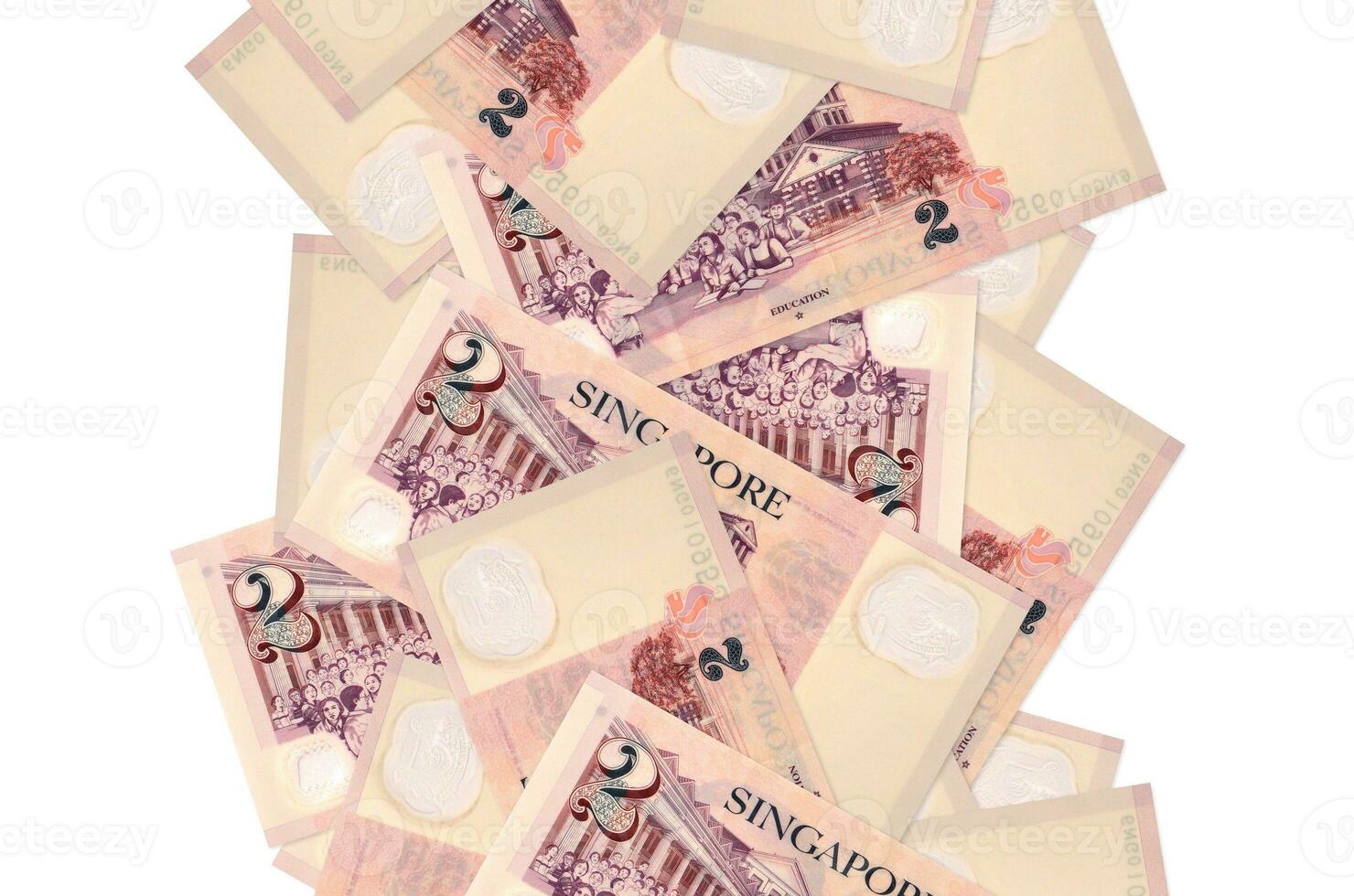 2 billetes de dólares singapurenses volando hacia abajo aislados en blanco. muchos billetes cayendo con copyspace blanco en el lado izquierdo y derecho foto