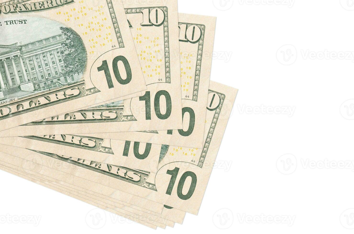 10 US dollars bills lies in small bunch or pack isolated on white. Mockup with copy space. Business and currency exchange photo