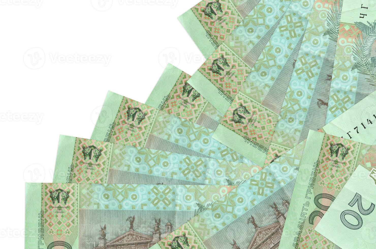 20 Ukrainian hryvnias bills lies in different order isolated on white. Local banking or money making concept photo