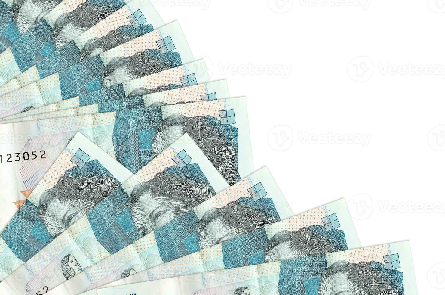 2 Colombian pesos bills lies isolated on white background with copy space stacked in fan close up photo