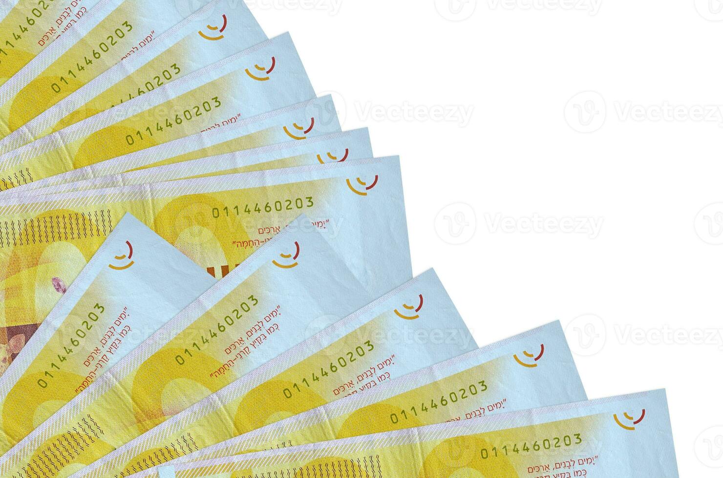 100 Israeli new shekels bills lies isolated on white background with copy space stacked in fan close up photo