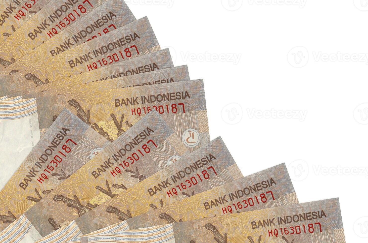 2000 Indonesian rupiah bills lies isolated on white background with copy space stacked in fan close up photo