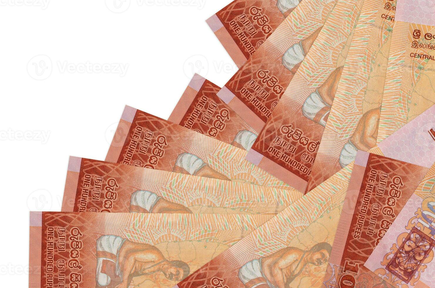 100 Sri Lankan rupees bills lies in different order isolated on white. Local banking or money making concept photo