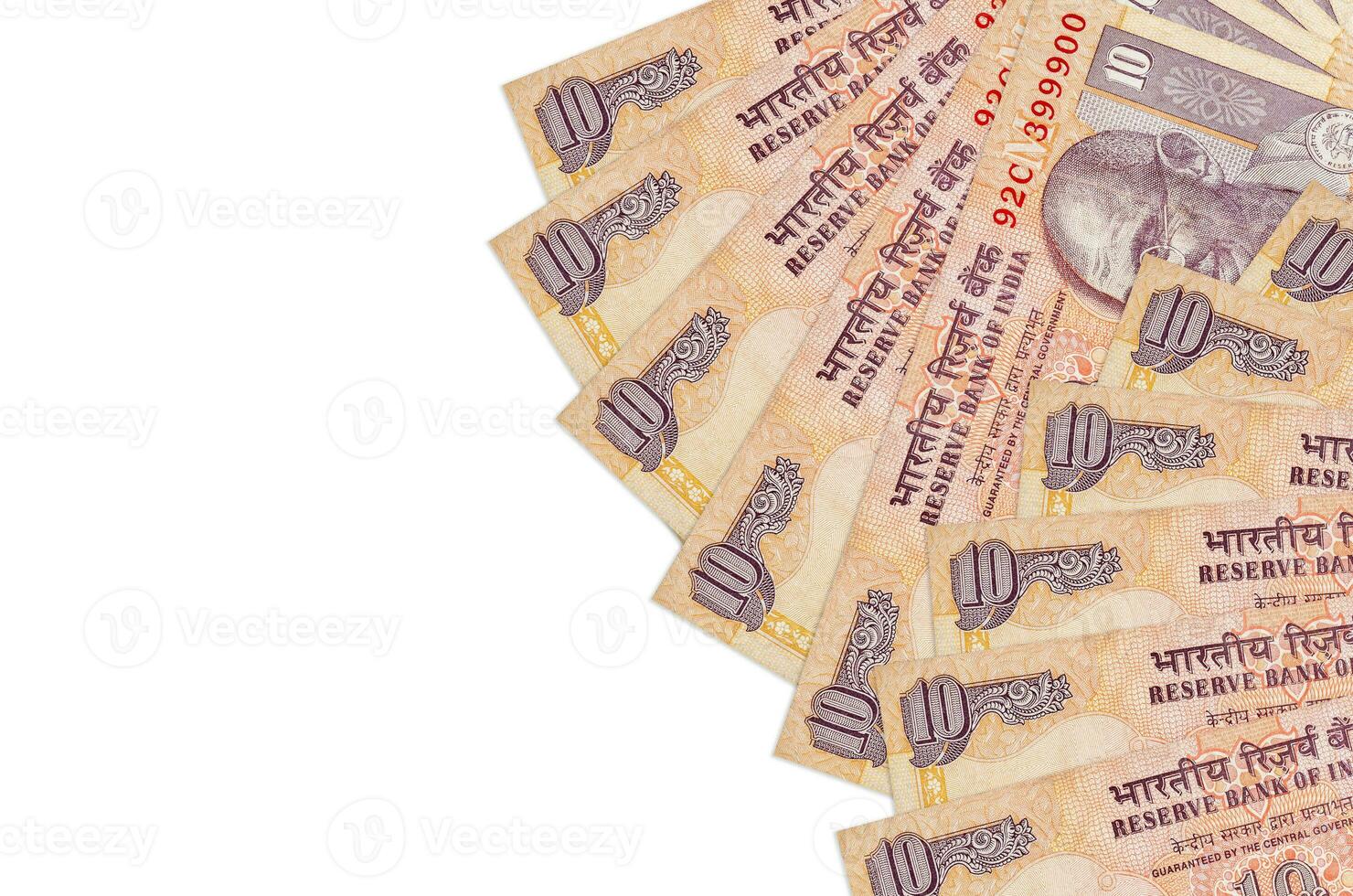 10 Indian rupees bills lies isolated on white background with copy space. Rich life conceptual background photo