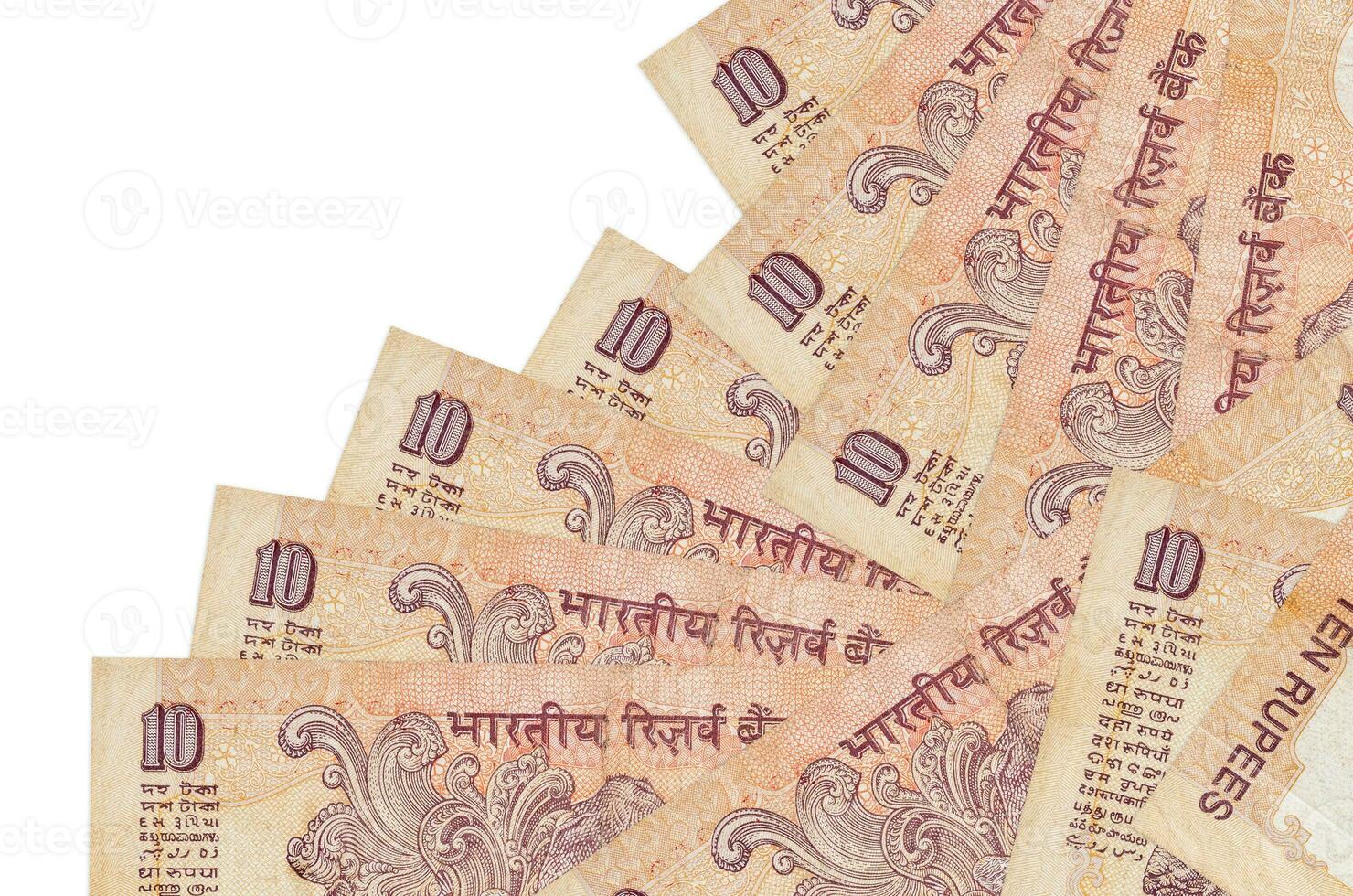 10 Indian rupees bills lies in different order isolated on white. Local banking or money making concept photo