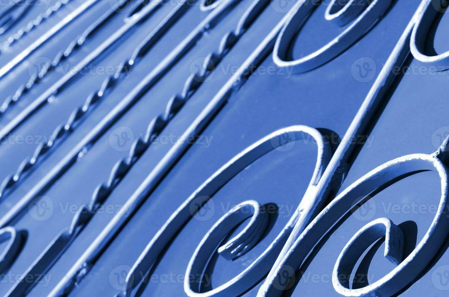 Metal texture of a piece of phantom classic blue wall with a forged pattern photo