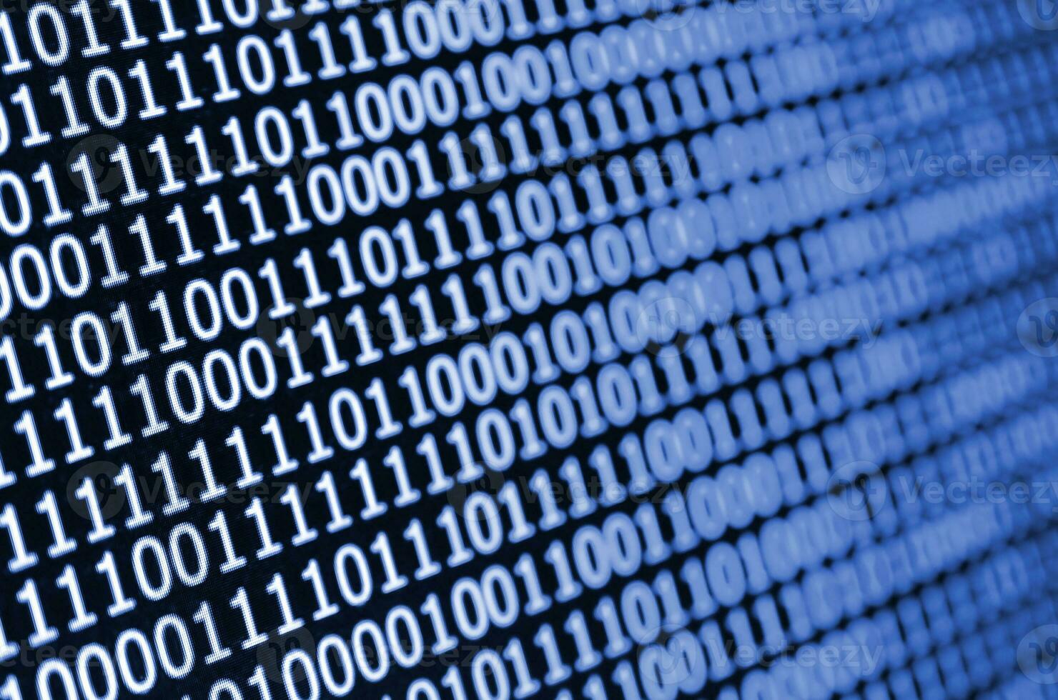 Macro shot of binary code on the monitor of an office computer. The concept of the programmer's work. The flow of digital information strings. phantom classic blue color photo