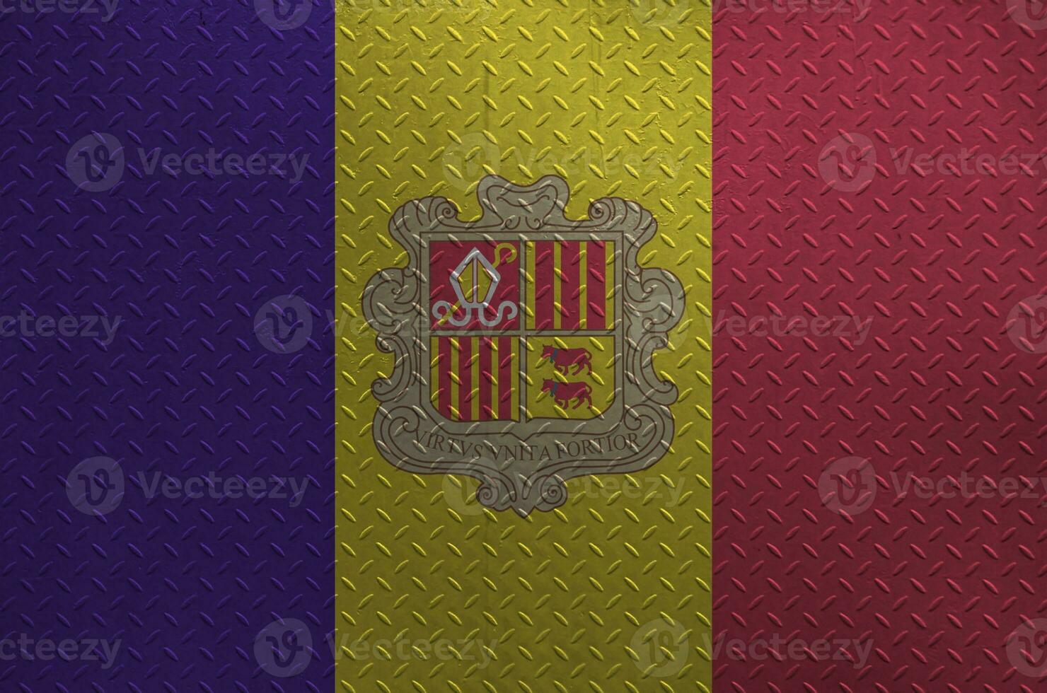 Andorra flag depicted in paint colors on old brushed metal plate or wall closeup. Textured banner on rough background photo