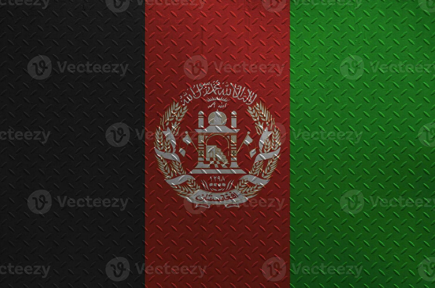 Afghanistan flag depicted in paint colors on old brushed metal plate or wall closeup. Textured banner on rough background photo