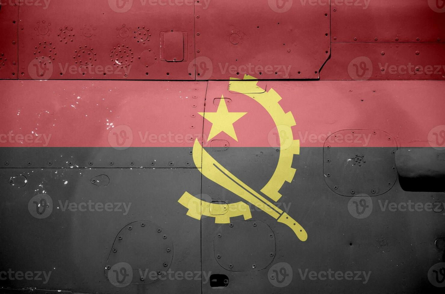 Angola flag depicted on side part of military armored helicopter closeup. Army forces aircraft conceptual background photo