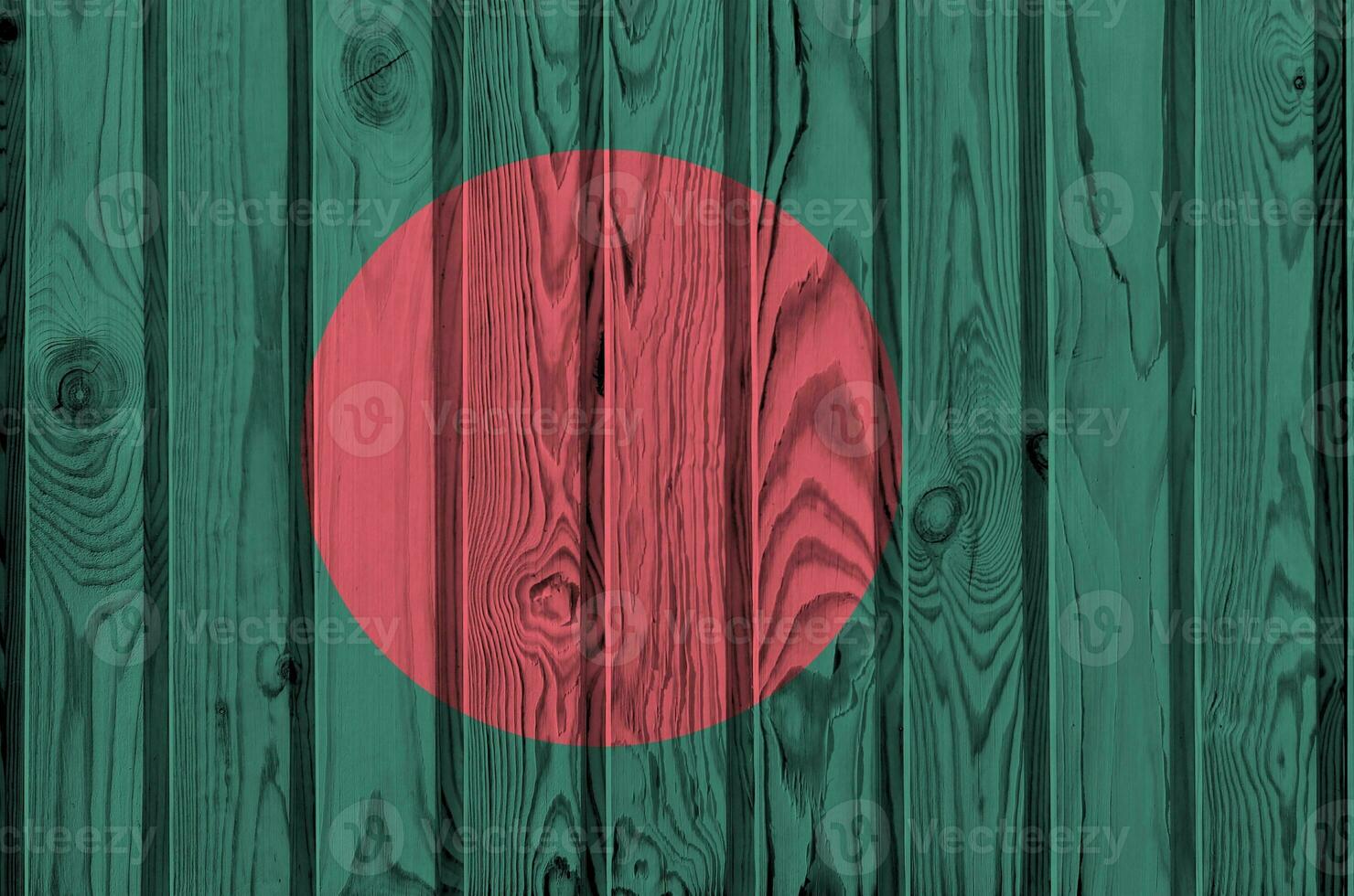Bangladesh flag depicted in bright paint colors on old wooden wall. Textured banner on rough background photo
