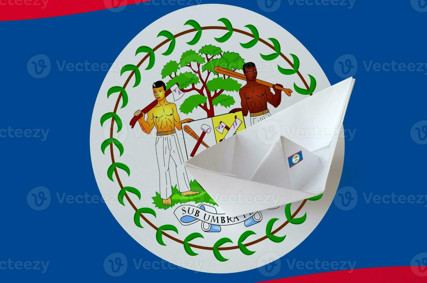 Belize flag depicted on paper origami ship closeup. Handmade arts concept photo