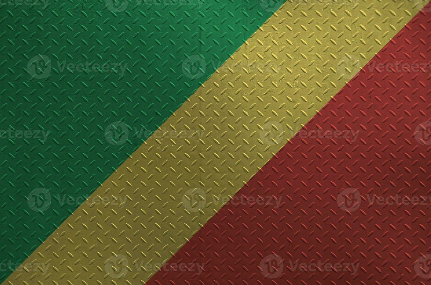 Congo flag depicted in paint colors on old brushed metal plate or wall closeup. Textured banner on rough background photo
