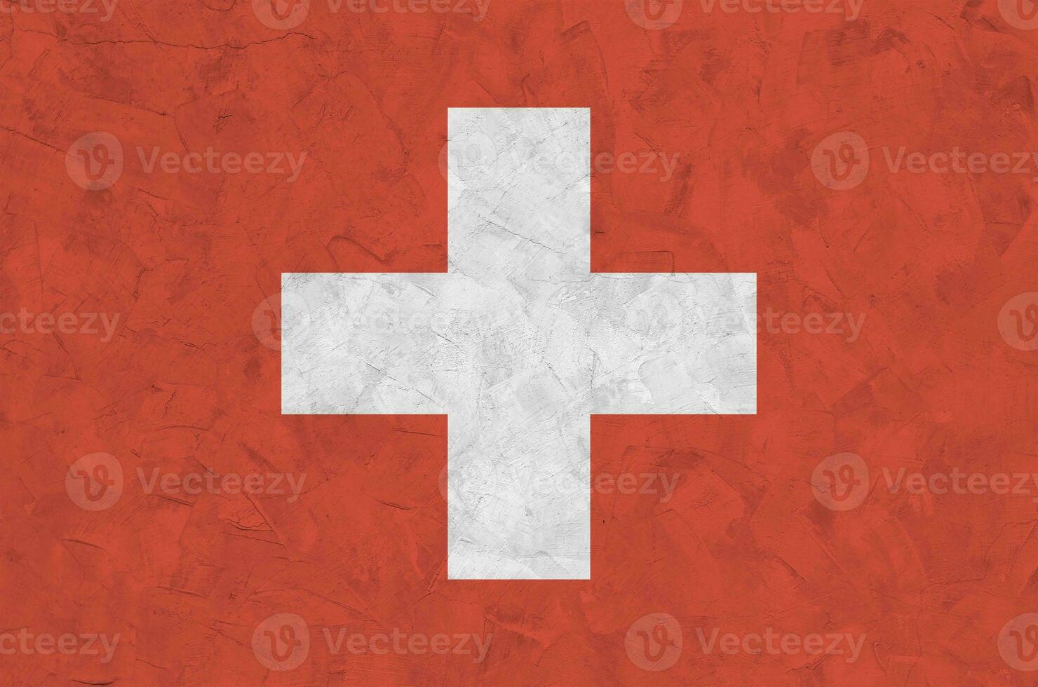 Switzerland flag depicted in bright paint colors on old relief plastering wall. Textured banner on rough background photo