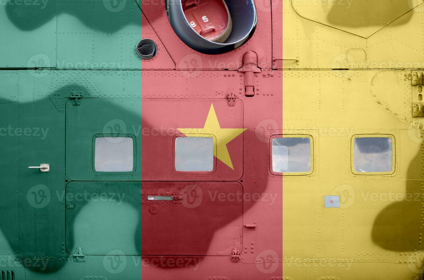 Cameroon flag depicted on side part of military armored helicopter closeup. Army forces aircraft conceptual background photo