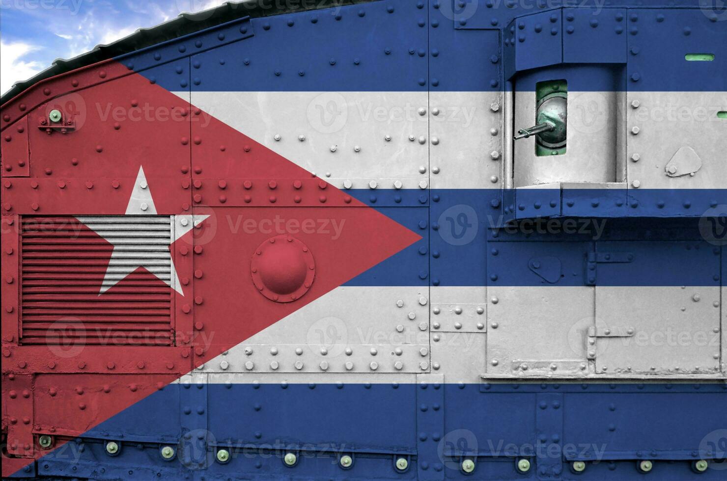 Cuba flag depicted on side part of military armored tank closeup. Army forces conceptual background photo