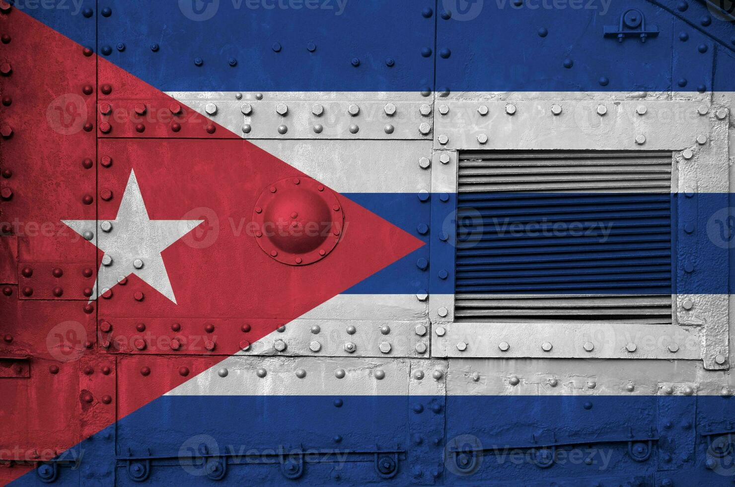 Cuba flag depicted on side part of military armored tank closeup. Army forces conceptual background photo