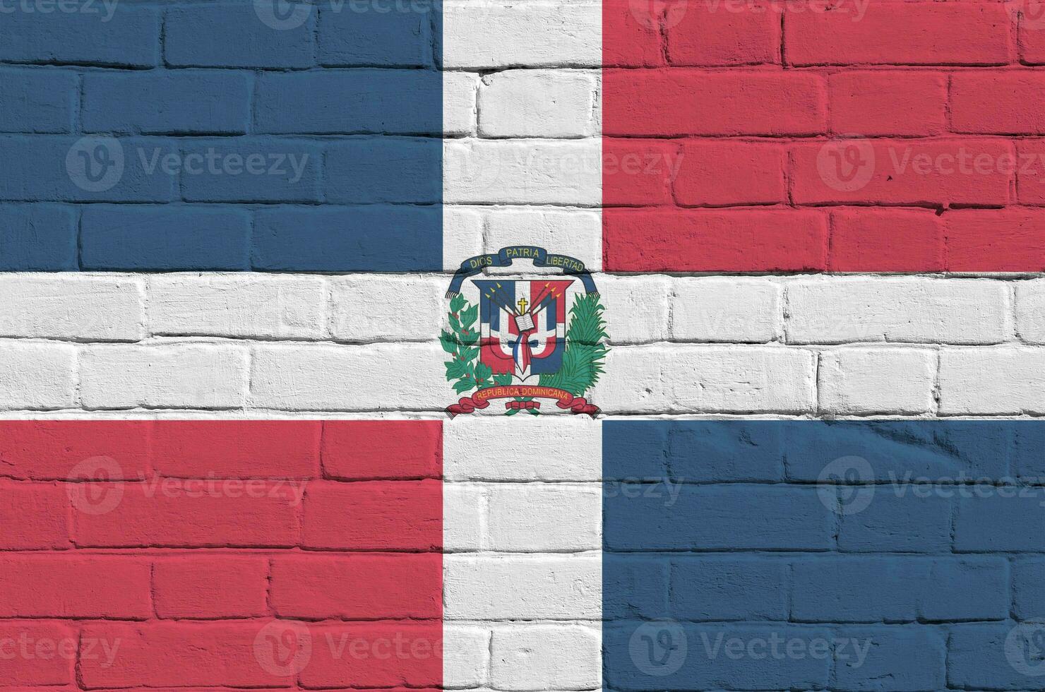 Dominican Republic flag depicted in paint colors on old brick wall. Textured banner on big brick wall masonry background photo