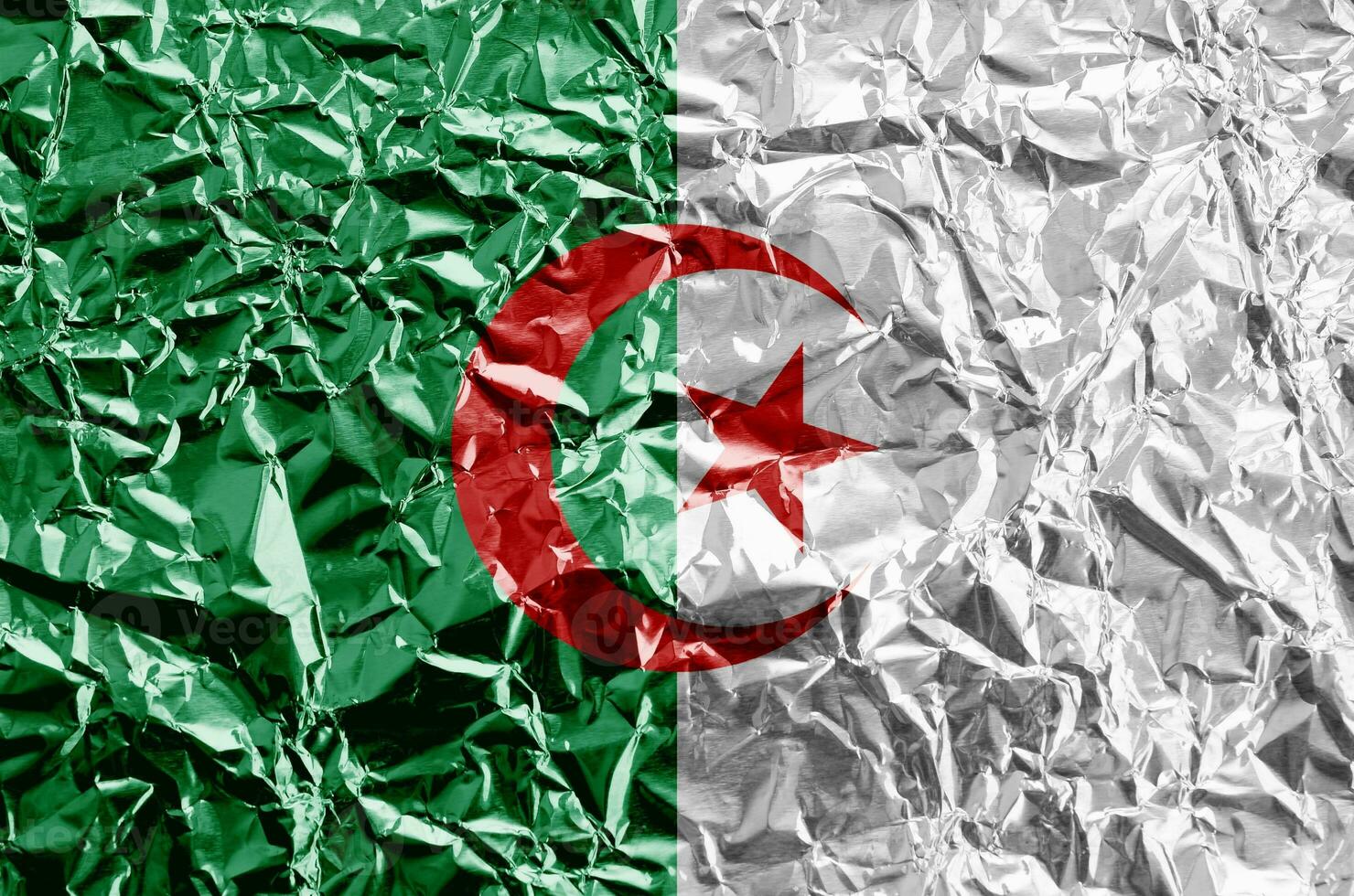 Algeria flag depicted in paint colors on shiny crumpled aluminium foil closeup. Textured banner on rough background photo