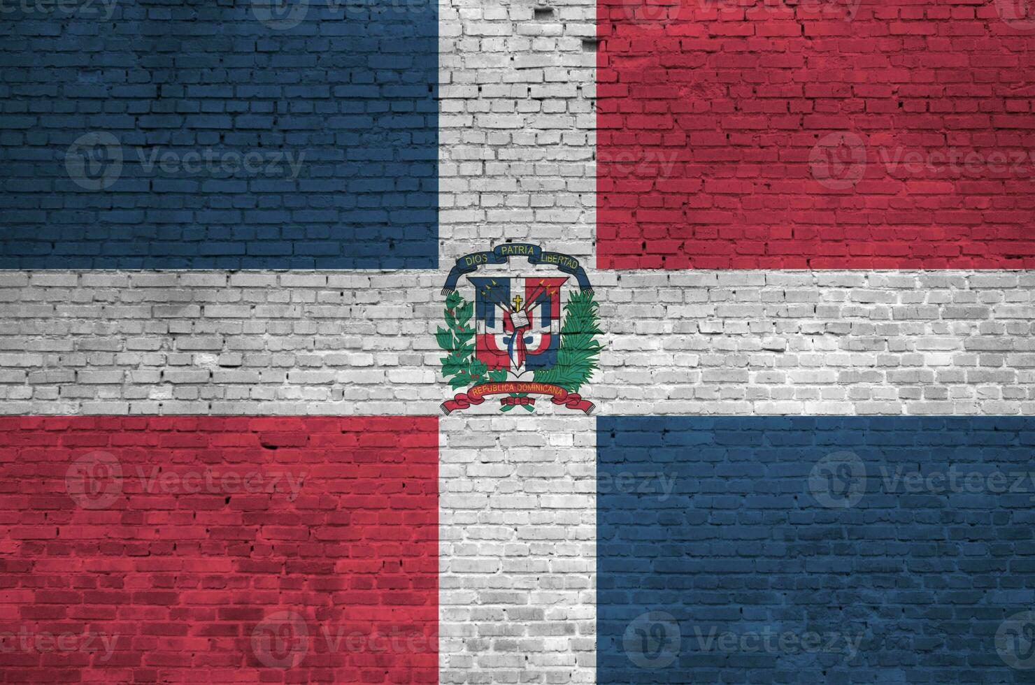 Dominican Republic flag depicted in paint colors on old brick wall. Textured banner on big brick wall masonry background photo