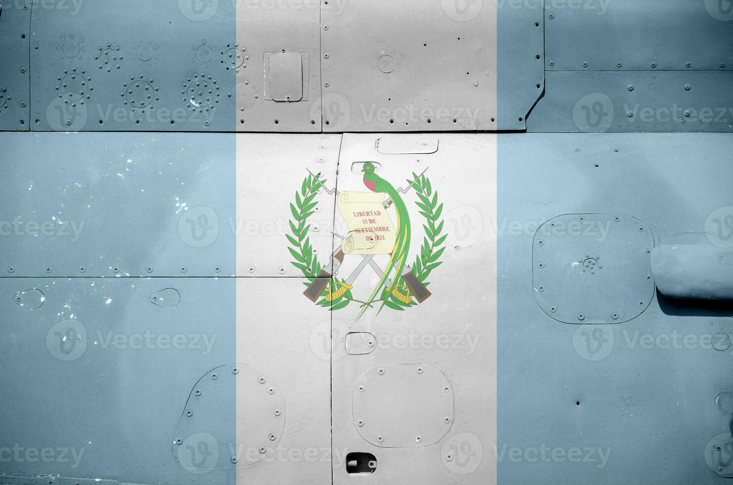 Guatemala flag depicted on side part of military armored helicopter closeup. Army forces aircraft conceptual background photo