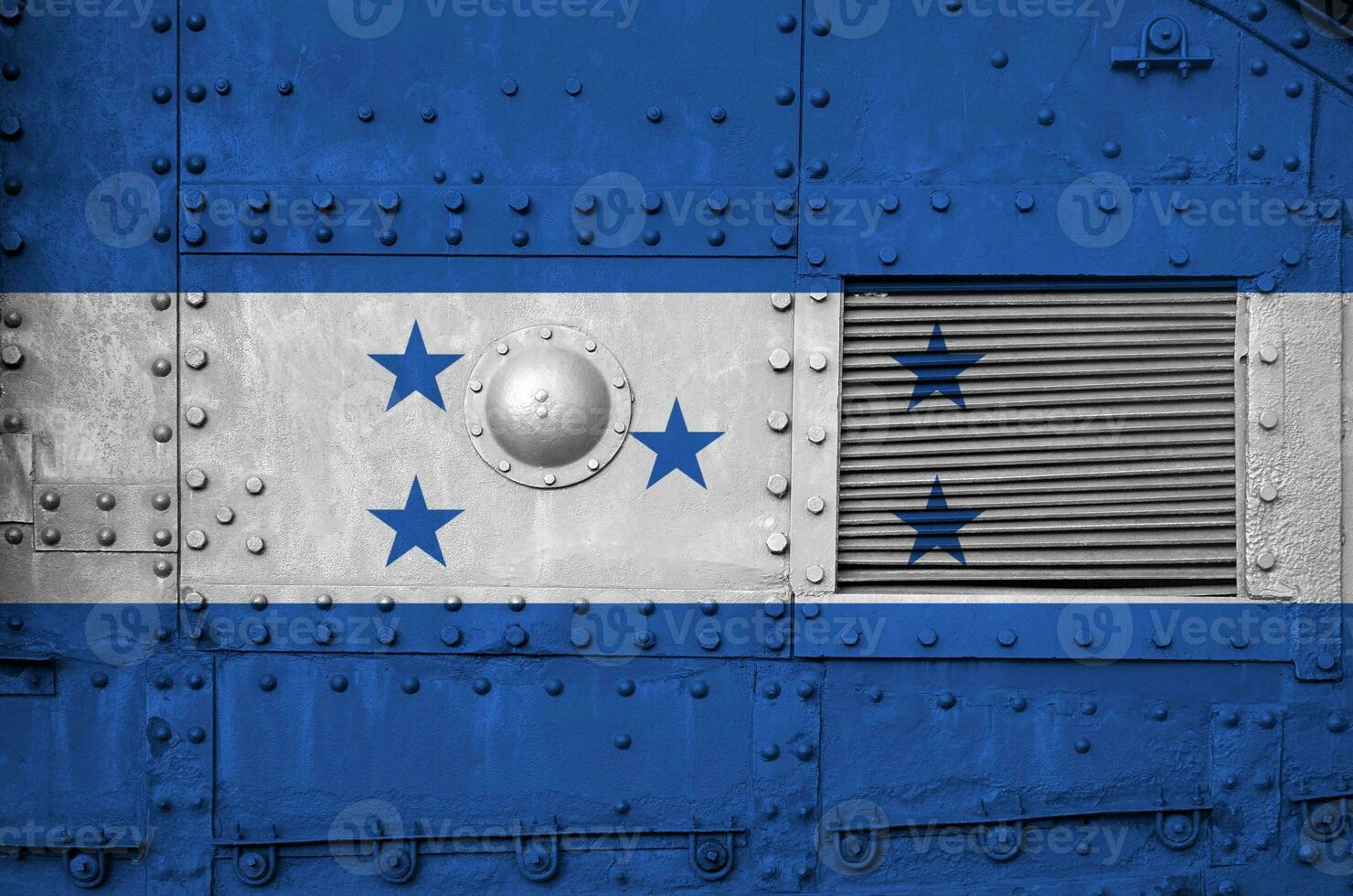 Honduras flag depicted on side part of military armored tank closeup. Army forces conceptual background photo