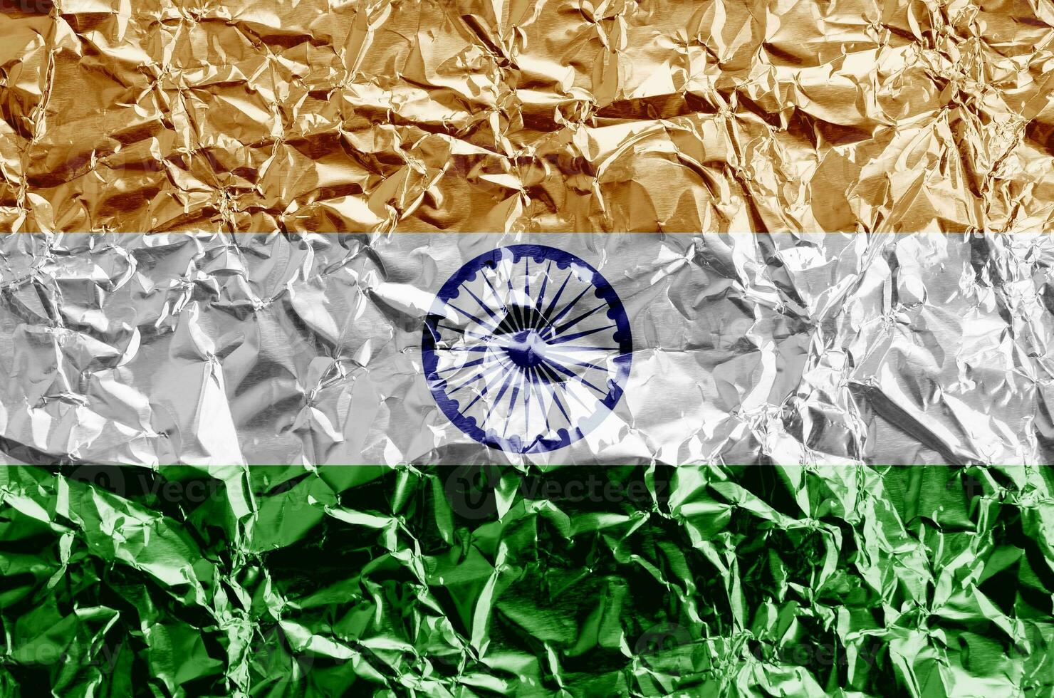 India flag depicted in paint colors on shiny crumpled aluminium foil closeup. Textured banner on rough background photo