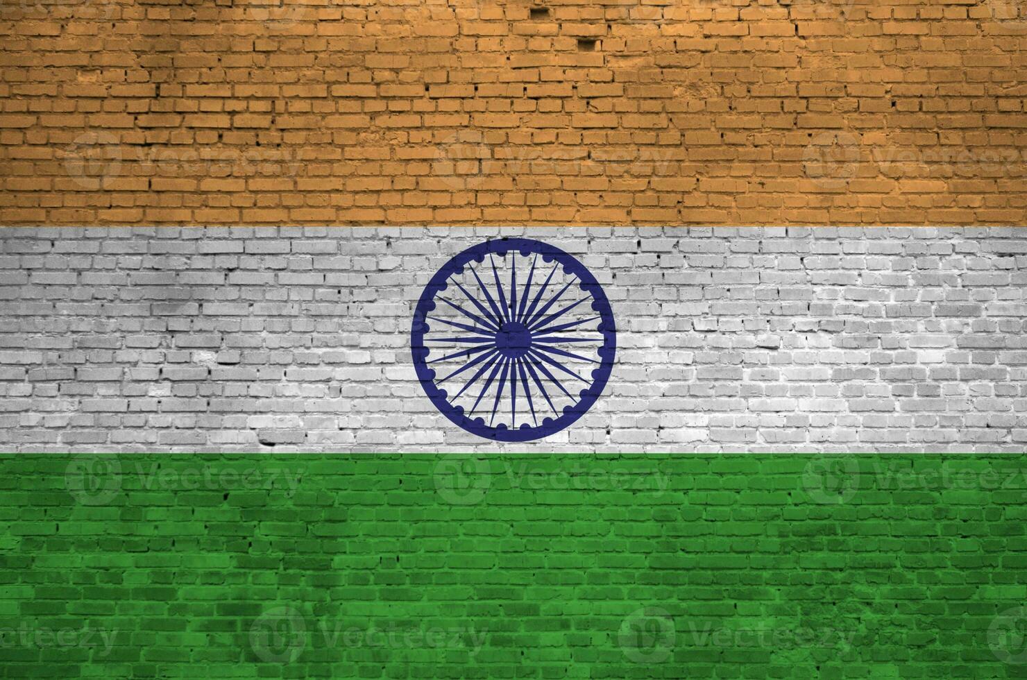 India flag depicted in paint colors on old brick wall. Textured banner on big brick wall masonry background photo