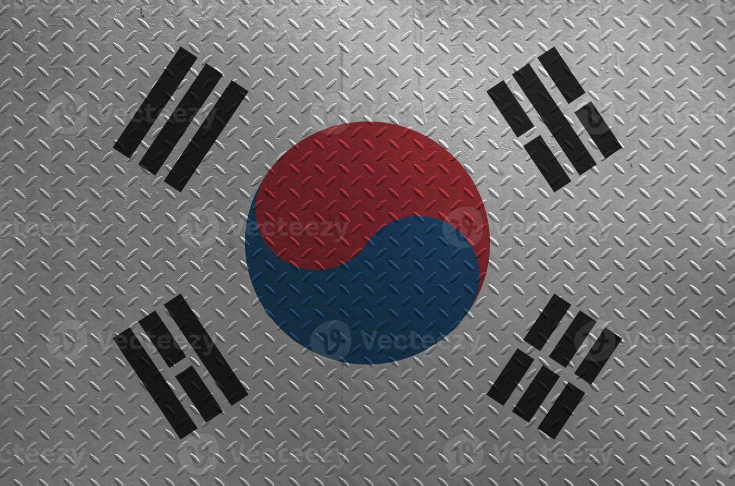 South Korea flag depicted in paint colors on old brushed metal plate or wall closeup. Textured banner on rough background photo